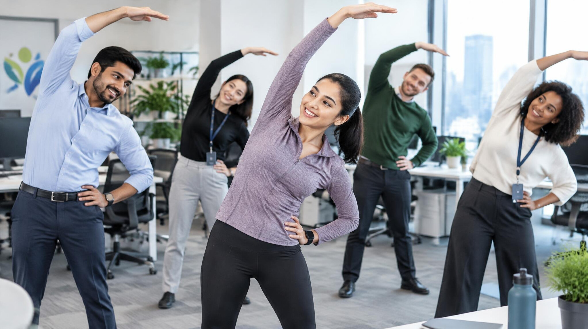 team of employees exercising in office
